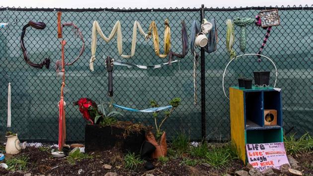 A community garden outside a homeless encampment.Today, Walker has come to symbolize a crisis that has reached historic proportions in one of America’s wealthiest states. She became a casualty of the housing crisis after moving back to Oakland to escape domestic violence. She initially stayed with family and in hotels while looking for housing but quickly realised she could not afford rental prices in the Bay Area. (Philip Pacheco / AFP)