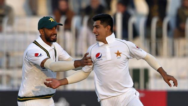 Pakistan pacer Naseem Shah, right, celebrates with teammate Shan Masood.(AP) Pakistan pacer Naseem Shah, right, celebrates with teammate Shan Masood.(AP)