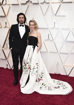 Adam Driver, left, and Joanne Tucker arrive at the Oscars on Sunday, Feb. 9, 2020, at the Dolby Theatre in Los Angeles. (Photo by Jordan Strauss/Invision/AP) (Jordan Strauss/Invision/AP)