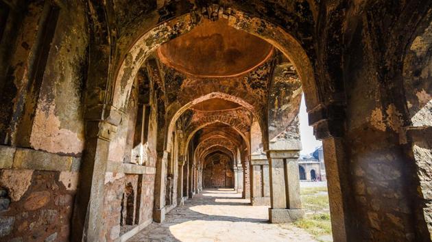 The monument currently wears a dilapidated look about it — stones missing from its arches, tilted pillars, cracks on its walls and terrace, as well as eroded plasterwork. Further, according to an ASI official currently working on the conservation plan, the mosque is frequented by anti-social elements, making it unsafe for those living nearby. (Amal KS / HT Photo)