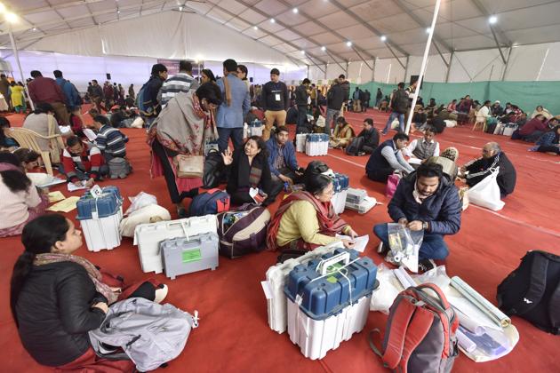 New Delhi, India - Feb. 7, 2020: Electoral officials inspect EVM and VVPAT machines at the Jija Bai Industrial Training Institute for Women distribution centre at Siri Fort, in New Delhi, India, on Friday, February 7, 2020. (Photo by Sanjeev Verma/ Hindustan Times) (Sanjeev Verma/HT PHOTO) New Delhi, India - Feb. 7, 2020: Electoral officials inspect EVM and VVPAT machines at the Jija Bai Industrial Training Institute for Women distribution centre at Siri Fort, in New Delhi, India, on Friday, February 7, 2020. (Photo by Sanjeev Verma/ Hindustan Times) (Sanjeev Verma/HT PHOTO)