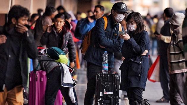 Tourists are seen wearing masks in light of the coronavirus scare, at Jaipur Railway Station, Rajasthan. The government has screened 1,76,703 people aboard 1,636 flights from China, Hong Kong, Singapore and Thailand at 21 airports. Almost 8,000 people with history of travel to China are also being monitored. (Raj K Raj / HT Photo)