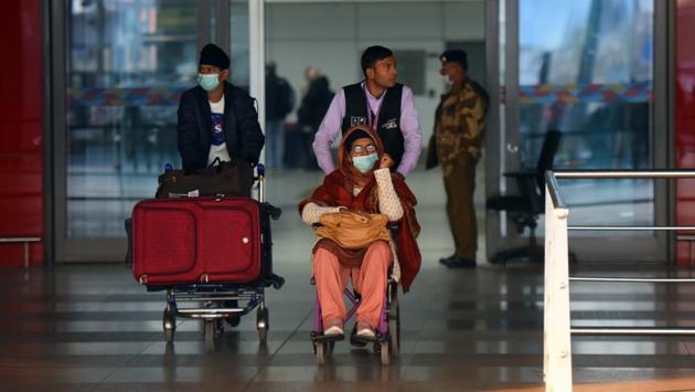 People cover their faces with masks amid coronavirus scare, at Indira Gandhi International (IGI) Airport, New Delhi, on February 1. Researchers from the Humboldt University and Robert Koch Institute in Berlin have developed the model that analyses air transportation pattern to calculate the relative risk for the 30 most vulnerable countries (excluding China) of importing cases of the viral disease. (Amal KS / HT Photo)