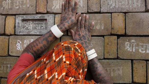 FILE- In this Nov. 11, 2019 file photo, a Hindu woman devotee prays to the bricks reading "Shree Ram" ( Lord Ram), which are expected to be used in constructing the Ram temple, in Ayodhya, India. India’s Supreme Court on Thursday dismissed petitions seeking a review of its recent ruling in favor of the building of a Hindu temple on a disputed site in northern India where a 16th century mosque was torn down by Hindu hard-liners in 1992.. (AP Photo/Rajesh Kumar Singh, File)(AP file photo for representation)