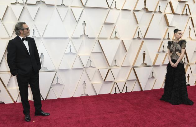 Joaquin Phoenix, left, and Rooney Mara arrive at the Oscars on Sunday, Feb. 9, 2020, at the Dolby Theatre in Los Angeles. (Photo by Richard Shotwell/Invision/AP) (Richard Shotwell/Invision/AP)