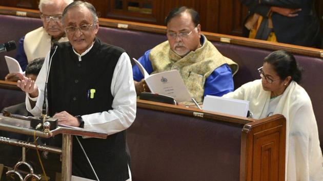 West Bengal Finance Minister Amit Mitra presents the state Budget 2020-21 with chief minister Mamata Banerjee sitting behind him at the Legislative Assembly in Kolkata on Monday.(SAMIR JANA/HT PHOTO.)