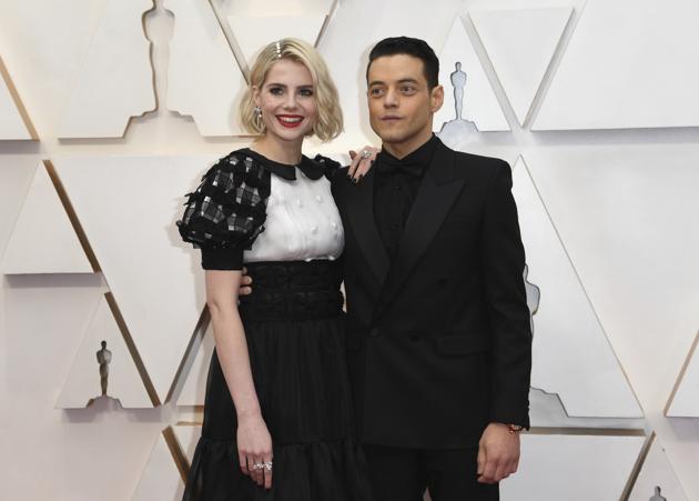 Lucy Boynton, left, and Rami Malek arrive at the Oscars on Sunday, Feb. 9, 2020, at the Dolby Theatre in Los Angeles. (Photo by Richard Shotwell/Invision/AP) (Richard Shotwell/Invision/AP)