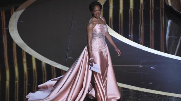 Regina King walks onstage to present the award for best performance by an actor in a supporting role at the Oscars on Sunday, Feb. 9, 2020, at the Dolby Theatre in Los Angeles. (AP Photo/Chris Pizzello)(Chris Pizzello/Invision/AP)