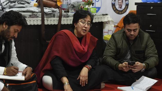 Aam Aadmi Party candidate from Kalkaji constituency Atishi interacts with party workers, in this file photo.(Burhaan Kinu/HT)
