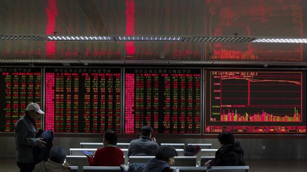 Chinese investors monitor stock prices at a brokerage house in Beijing, Friday, Dec. 6, 2019. Shares swung higher in Asia on Friday after a wobbly day of trading on Wall Street as investors awaited a U.S. government jobs report and kept an eye out for developments in China-U.S. trade talks. (AP) Chinese investors monitor stock prices at a brokerage house in Beijing, Friday, Dec. 6, 2019. Shares swung higher in Asia on Friday after a wobbly day of trading on Wall Street as investors awaited a U.S. government jobs report and kept an eye out for developments in China-U.S. trade talks. (AP)