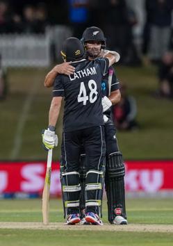 New Zealand's Colin de Grandhomme and Tom Latham celebrate the win during the One Day cricket international between India and New Zealand at Bay Oval, Tauranga, New Zealand, Tuesday, Feb. 11, 2020. (John Cowpland/Photosport via AP) (AP)