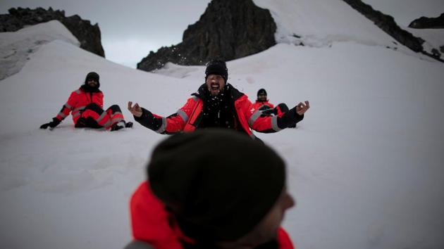 Greenpeace activists play in the snow during a day off at Orne Harbour. The UN will meet from March 23 to April 3 to try to agree on a global ocean treaty, which could then take years to ratify. (Ueslei Marcelino / REUTERS)