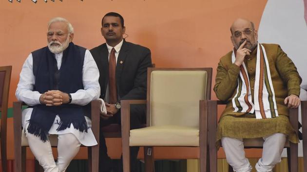 Prime Minister Narendra Modi and Union Home Minister Amit Shah listen to newly elected Bharatiya Janata Party (BJP) president J.P.Nadda at BJP headquarters. (Sanjeev Verma/HT PHOTO) Prime Minister Narendra Modi and Union Home Minister Amit Shah listen to newly elected Bharatiya Janata Party (BJP) president J.P.Nadda at BJP headquarters. (Sanjeev Verma/HT PHOTO)