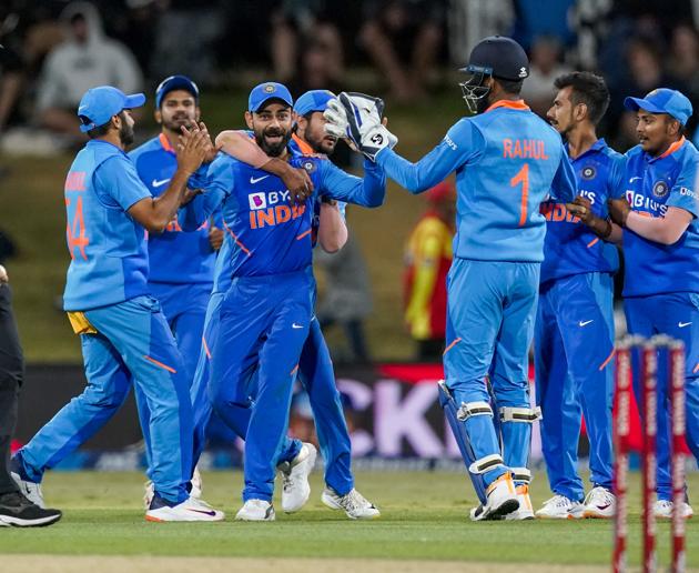 India's Virat Kohli, centre, celebrates the wicket of New Zealand's Jimmy Neesham during the One Day cricket international between India and New Zealand at Bay Oval, Tauranga, New Zealand, Tuesday 11 Feb 2020. (John Cowpland/Photosport via AP) (AP)