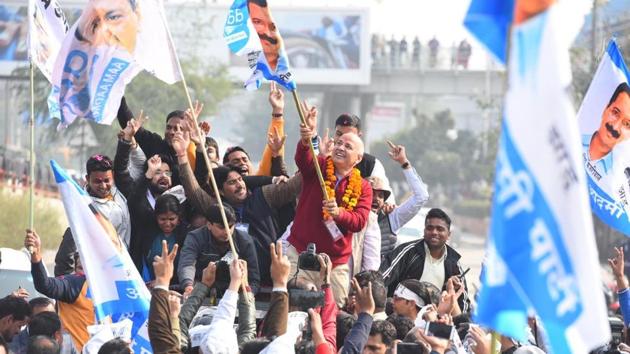 Manish Sisodia after winning the Patparganj seat. Aam Aadmi Party’s Raghav Chadha celebrated with party workers on winning from Rajinder Nagar assembly constituency. AAP’s Atishi, who was up against BJP’s Dharambir Singh, also won herself the Kalkaji assembly constituency. (Raj K Raj / HT Photo)