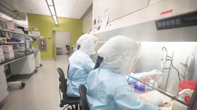 Scientists work in VIDO-InterVac's (Vaccine and Infectious Disease Organization-International Vaccine Centre) containment level 3 laboratory, where the organization is currently researching a vaccine for novel coronavirus, at the University of Saskatchewan in Canada. (via REUTERS) Scientists work in VIDO-InterVac's (Vaccine and Infectious Disease Organization-International Vaccine Centre) containment level 3 laboratory, where the organization is currently researching a vaccine for novel coronavirus, at the University of Saskatchewan in Canada. (via REUTERS)