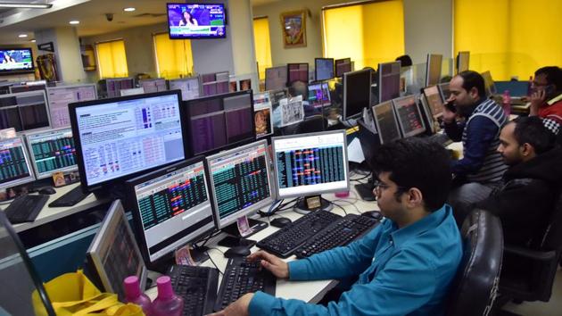 Traders work on the floor as Sensex and nifty reach highest in share market, in Kolkata on Thursday. (ANI Photo) Traders work on the floor as Sensex and nifty reach highest in share market, in Kolkata on Thursday. (ANI Photo)