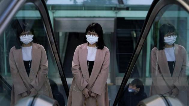 A woman wearing a mask is seen in Shanghai as China is hit by an outbreak of the novel coronavirus.(Reuters Photo)