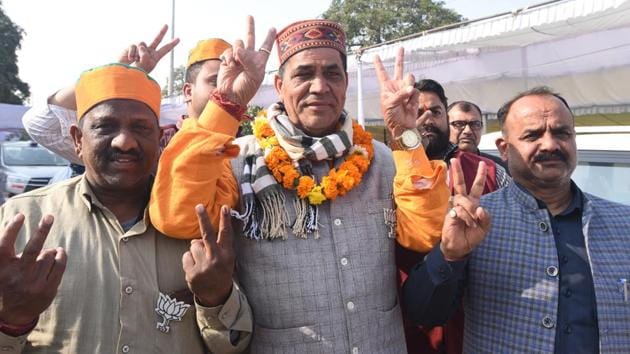 Mohan Singh Bisht, Bharatiya Janata Party (BJP) candidate from Karawal Nagar, and his supporters show victory signs after his win in the Delhi Legislative Assembly election 2020, while leaving the Industrial Training Institute (ITI) counting centre, Nand Nagri, in New Delhi, India, on Tuesday, February 11, 2020. (Sonu Mehta/HT PHOTO) Mohan Singh Bisht, Bharatiya Janata Party (BJP) candidate from Karawal Nagar, and his supporters show victory signs after his win in the Delhi Legislative Assembly election 2020, while leaving the Industrial Training Institute (ITI) counting centre, Nand Nagri, in New Delhi, India, on Tuesday, February 11, 2020. (Sonu Mehta/HT PHOTO)