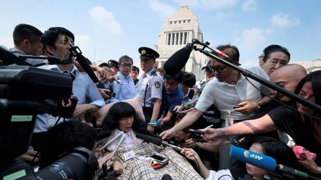 Japanese lawmaker Eiko Kimura, 54, is paralysed from the neck down except for one hand, after suffering a childhood injury. After being elected last year to the upper house of parliament, she is pushing for more integration of people with disabilities, driven by the memory of a childhood in a carehome -- where she sometimes felt she belonged to a different world than able-bodied people. (Kazuhiro Nogi / AFP)