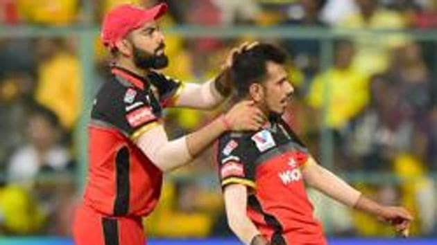 RCB bowler Yuzvendra Chahal and Virat Kohli celebrate after claiming the wicket.(PTI)