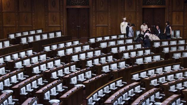 The upper house is paying for Kimura and Funago’s assistants, but the new lawmakers want rules changed to help the 11,500 other seriously disabled people who rely on public care. Both use special reclined chairs in the chamber. They have faced some criticism, with a tweet declaring their presence in parliament “a nuisance” that would impede speedy deliberations drawing 49,000 likes and 23,000 retweets. (Tomohiro Ohsumi / Getty Images)