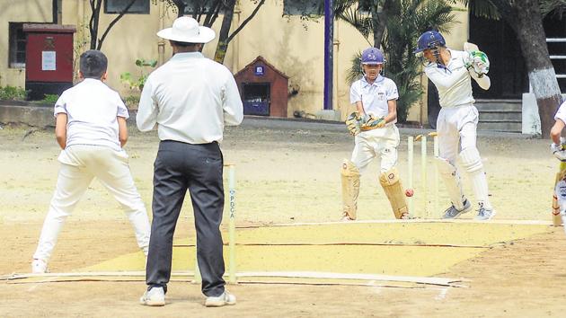 A Blossom school bowler scalps the wicket of Rohan Dherange of Prodigy school during the PDCA school cricket tournament at Law College ground on Wednesday. (MILIND SAURKAR/HT) A Blossom school bowler scalps the wicket of Rohan Dherange of Prodigy school during the PDCA school cricket tournament at Law College ground on Wednesday. (MILIND SAURKAR/HT)