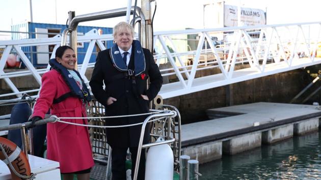 Britain's Prime Minister Boris Johnson and Home Secretary Priti Patel board a patrol boat at the docks in Southampton. (AFP) Britain's Prime Minister Boris Johnson and Home Secretary Priti Patel board a patrol boat at the docks in Southampton. (AFP)
