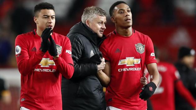 Manchester United manager Ole Gunnar Solskjaer, center, and Anthony Martial, right. (AP) Manchester United manager Ole Gunnar Solskjaer, center, and Anthony Martial, right. (AP)