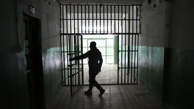 A guard opens a door inside a prison that holds foreign prisoners in Hasaka. The area around Qamishli city is mainly controlled by Kurdish fighters who helped defeat the Islamist militant group. They have since been pushed into a small pocket of northeastern Syria by Turkish-led forces who consider them a security threat. (Goran Tomasevic / REUTERS)