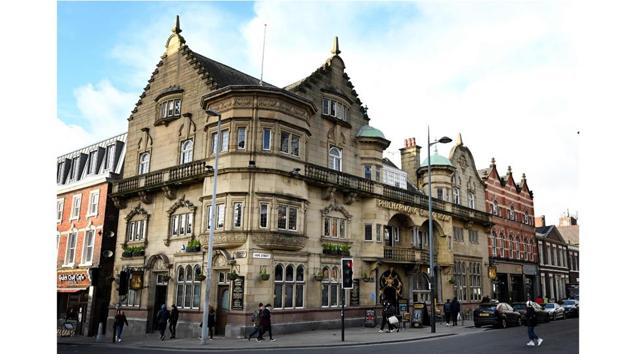 “The Phil”, as it’s known in the city, was built in 1898 by architect Walter W Thomas during the “golden age” of pub building in the 19th century. The venue, opposite the Liverpool Philharmonic Hall concert venue, is notable for its exuberant grand stone exterior and richly decorated interior. (Paul Ellis / AFP)