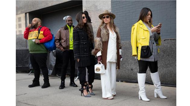 Fashionistas wait in line to enter a show during Fashion Week. (Mark Lennihan / AP)