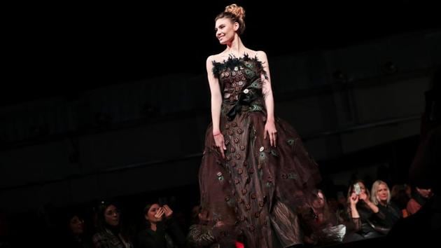 A model displays a design partially made of chocolate in a fashion show during an annual chocolate festival in Brussels, Thursday, Feb. 13, 2020. (AP Photo/Francisco Seco) (AP)