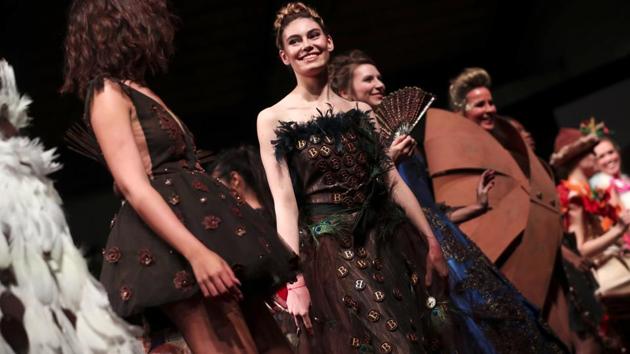 Model wear designs partially made of chocolate in a fashion show during an annual chocolate festival in Brussels, Thursday, Feb. 13, 2020. (AP Photo/Francisco Seco) (AP)