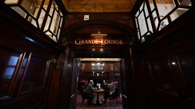 The pub, Grade II listed since 1955, now joins other architectural gems such as Buckingham Palace and Chatsworth House after Historic England upgraded it to a top-ranking Grade I. Duncan Wilson, chief executive of Historic England, called the Phil a remarkable survivor from the Victorian era. (Paul Ellis / AFP)
