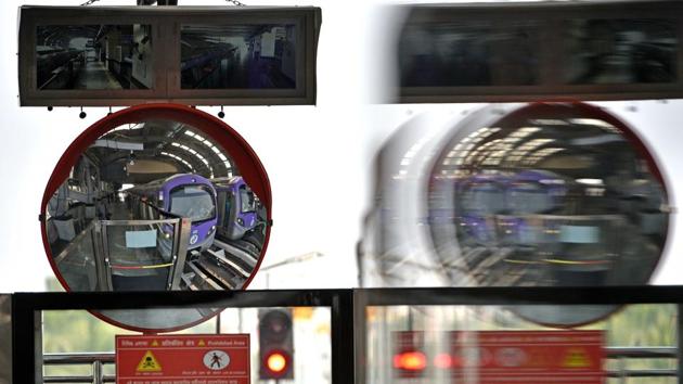 Giant convex mirror reflect stationed trains. The inaugural train zoomed off from Sector V station to traverse a 4.88-km distance to the Stadium, as Goyal said that the entire 16.5km stretch of the corridor—till Howrah Maidan—is likely to be completed in two years, according to news agency PTI. (Samir Jana / HT Photo)