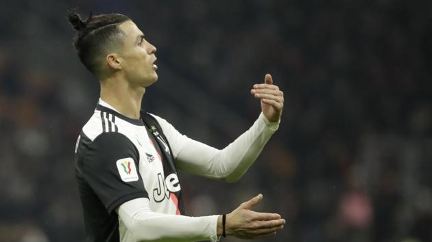 Juventus' Cristiano Ronaldo reacts after a missed scoring opportunity during an Italian Cup soccer match between AC Milan and Juventus at the San Siro stadium, in Milan, Italy, Thursday, Feb. 13, 2020. (AP Photo/Luca Bruno)(AP)