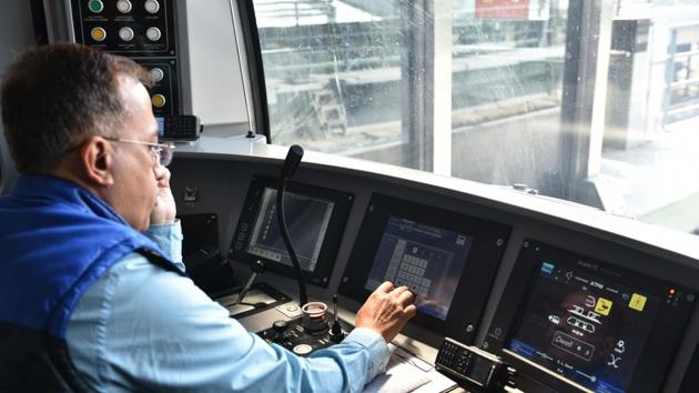 Driver Dipak Kumar helms the control panel of a train during a trial run. The Metro project, scheduled to be completed by June 2021, had faced an unprecedented jolt last year, when a tunnel-boring machine hit an aquifer in Bowbazar area of the city, causing severe ground subsidence and damage to several buildings. (Samir Jana / HT Photo)