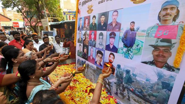People pay tribute to the martyred CPPF jawans, who lost their lives in a suicide bomber attack in Pulwama last year, in Chennai, on Friday.(PTI Photo)