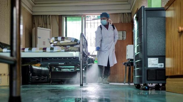 A doctor disinfects a room for medical staff with sanitizing equipment at a community health service centre, which has an isolated section to receive patients with mild symptoms caused by the novel coronavirus and suspected patients of the virus, in Qingshan district of Wuhan, Hubei province, China (Reuters File Photo) A doctor disinfects a room for medical staff with sanitizing equipment at a community health service centre, which has an isolated section to receive patients with mild symptoms caused by the novel coronavirus and suspected patients of the virus, in Qingshan district of Wuhan, Hubei province, China (Reuters File Photo)