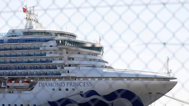 The cruise ship Diamond Princess, where dozens of passengers were tested positive for coronavirus, is seen through steel fence at Daikoku Pier Cruise Terminal in Yokohama, south of Tokyo, Japan. (REUTERS)