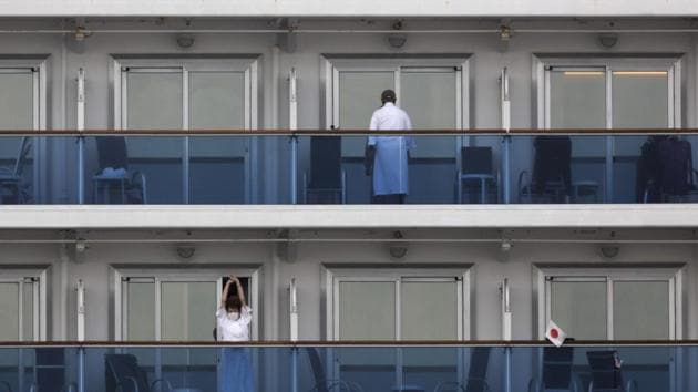 A quarantined passenger on the Diamond Princess cruise ship stretches on the balcony of his cabin Saturday, Feb. 15, 2020, in Yokohama, near Tokyo. A viral outbreak that began in China has infected more than 67,000 people globally. (AP) A quarantined passenger on the Diamond Princess cruise ship stretches on the balcony of his cabin Saturday, Feb. 15, 2020, in Yokohama, near Tokyo. A viral outbreak that began in China has infected more than 67,000 people globally. (AP)