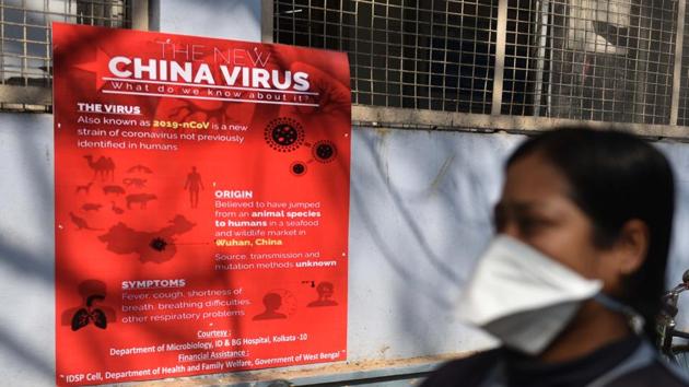 Precautionary posters at the Beleghata ID and BG Hospital where people have been wearing masks for safety from coronavirus in Kolkata, West Bengal.(Samir Jana/HT Photo)