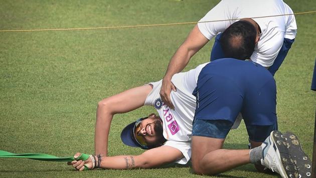 Indian bowlers Ishant Sharma stretches during a training session.(PTI)
