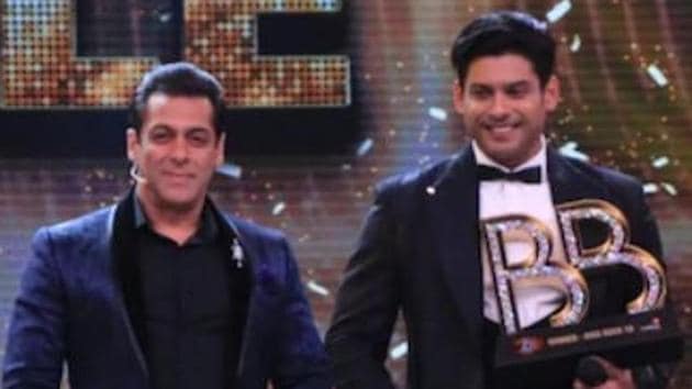 Sidharth Shukla poses with Salman Khan with the Bigg Boss 13 winners trophy.