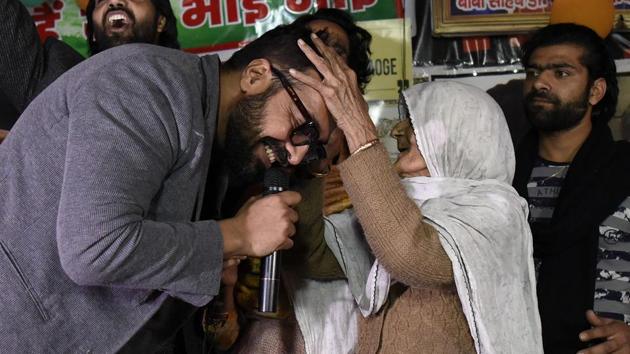 Film director Anurag Kashyap takes blessings from an elderly woman during the ongoing protests against CAA, NRC and NPR at Shaheen Bagh in New Delhi. Addressing the crowd, he said, “Continue your struggle with a smile no matter how much they provoke you because they don’t understand the language of empathy and love. These peaceful protests scare them.” (Biplov Bhuyan / HT Photo)