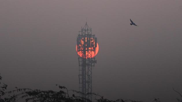 The sun rises behind a mobile communications tower on a winter cold morning, in Gurugram, India. (Yogendra Kumar/HT PHOTO) The sun rises behind a mobile communications tower on a winter cold morning, in Gurugram, India. (Yogendra Kumar/HT PHOTO)