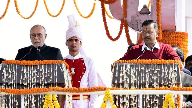 Lieutenant Governor Anil Baijal administered the oath of office and secrecy to Kejriwal and his six ministers. Before the national anthem was played, patriotic songs could also be heard at the Ramlila Maidan as excited party workers, as well as the crowd with people tricolour painted on their faces, clapped on. (Vipin Kumar / HT Photo) 