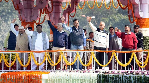 Chief Minister Arvind Kejriwal with newly sworn-in ministers of his Cabinet. “I want to tell all the two crore people of Delhi that you are a part of my family. Never hesitate to approach me and I will help everyone. We still have to do a lot for Delhi and I cannot do it alone. We make Delhi beautiful and better with your help,” Kejriwal said. (Arvind Yadav / HT Photo)