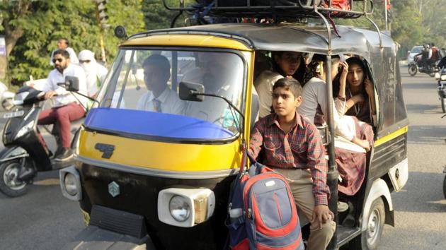 Schoolchildren pack auto-rickshaw on their way to school at Bhadson Road in Patiala on Saturday.(Bharat Bhushan/HT)